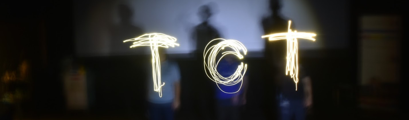 TCT written in light by three people with torches